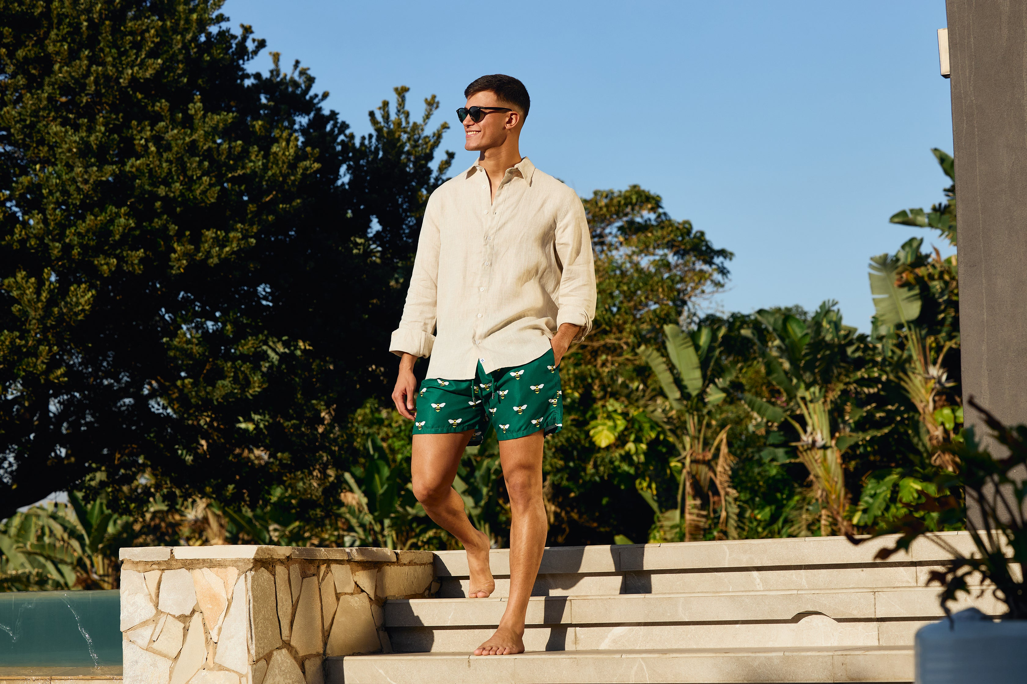 Breazies Mens linen shirt worn with emerald Breazies swim shorts
