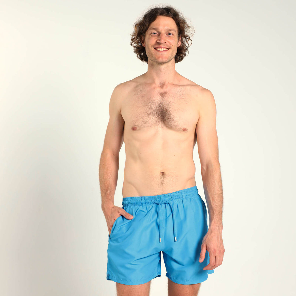 Breazies men’s bubblegum blue swim shorts with an elastic waistband and blue drawstring.