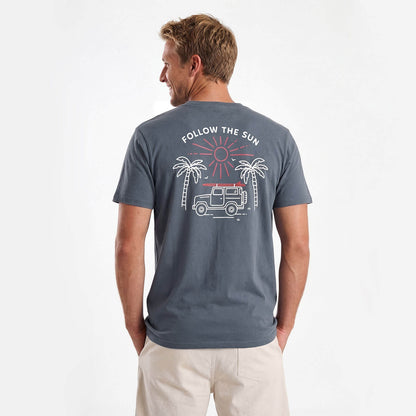 Man wearing a grey t-shirt with a graphic design on the back, standing against a white background