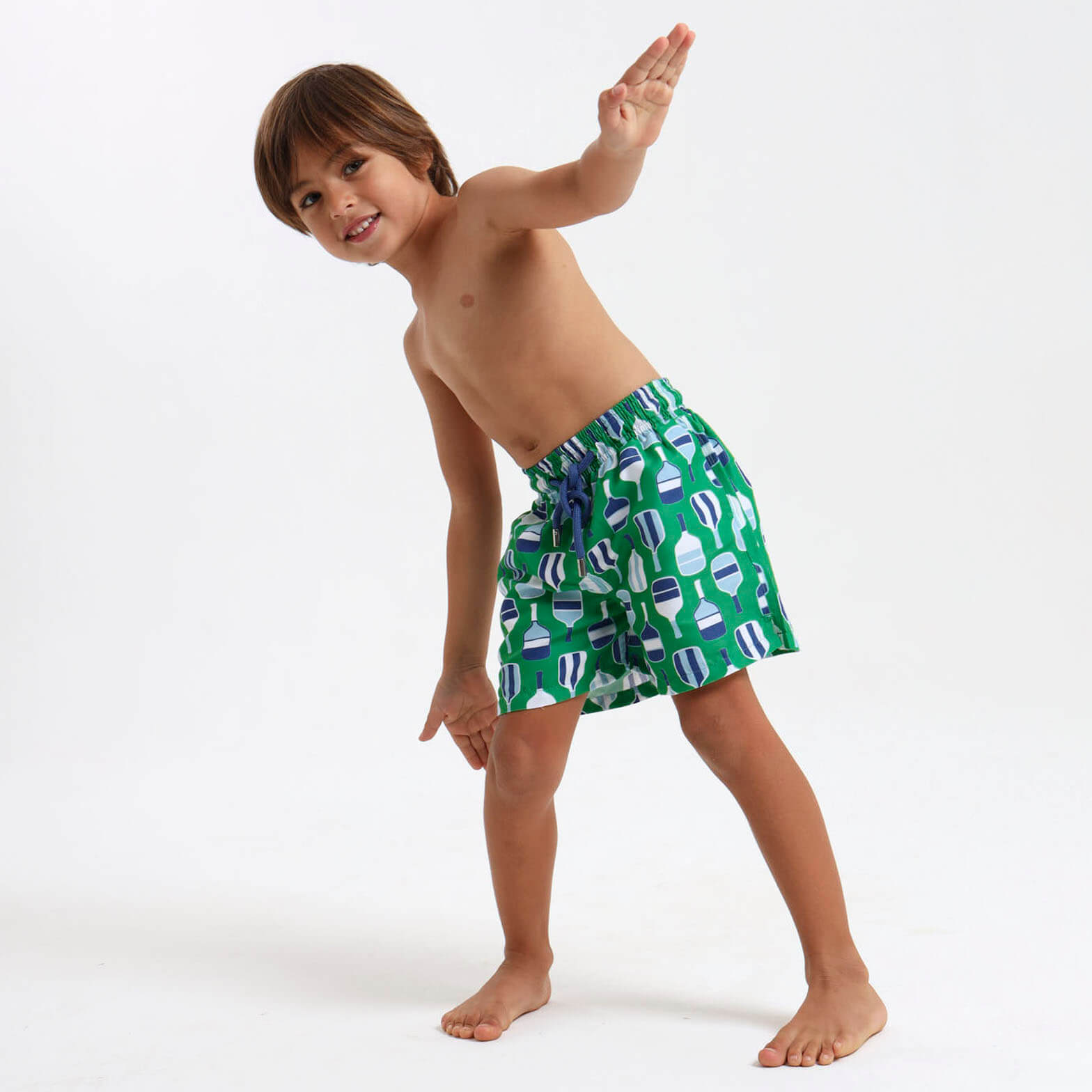Boys swim shorts with an elasticated design and a green and blue beach bat design
