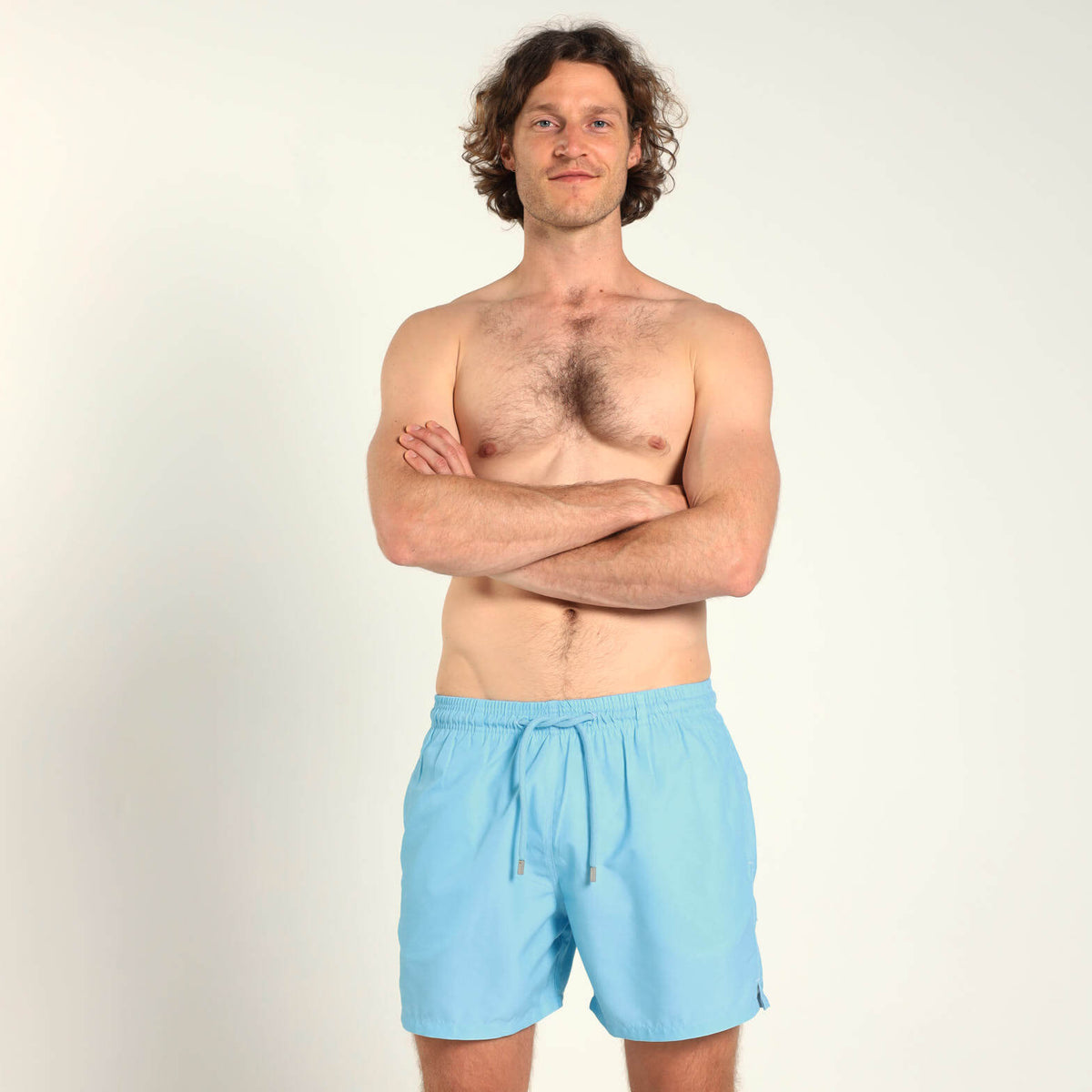 Breazies men’s baby blue swim shorts with an elastic waistband and blue drawstring.