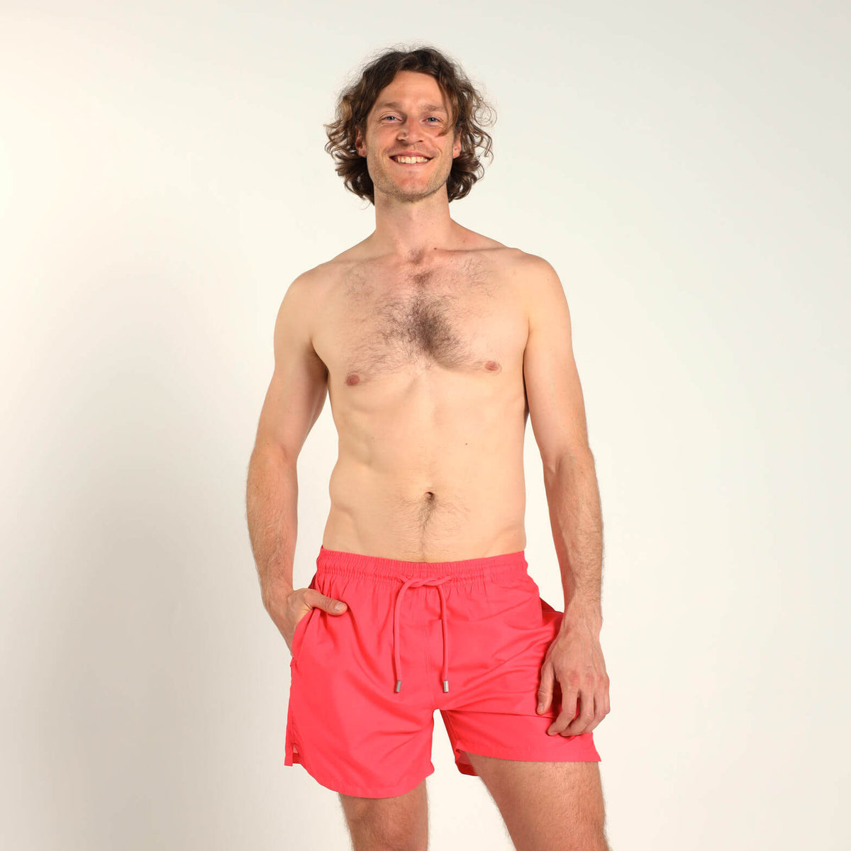 Breazies men’s coral swim shorts with an elastic waistband and coral drawstring.