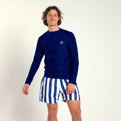 Breazies men's swim shorts with royal blue and white vertical stripes, an elastic waistband and blue drawstring. Paired with a blue rash vest.
