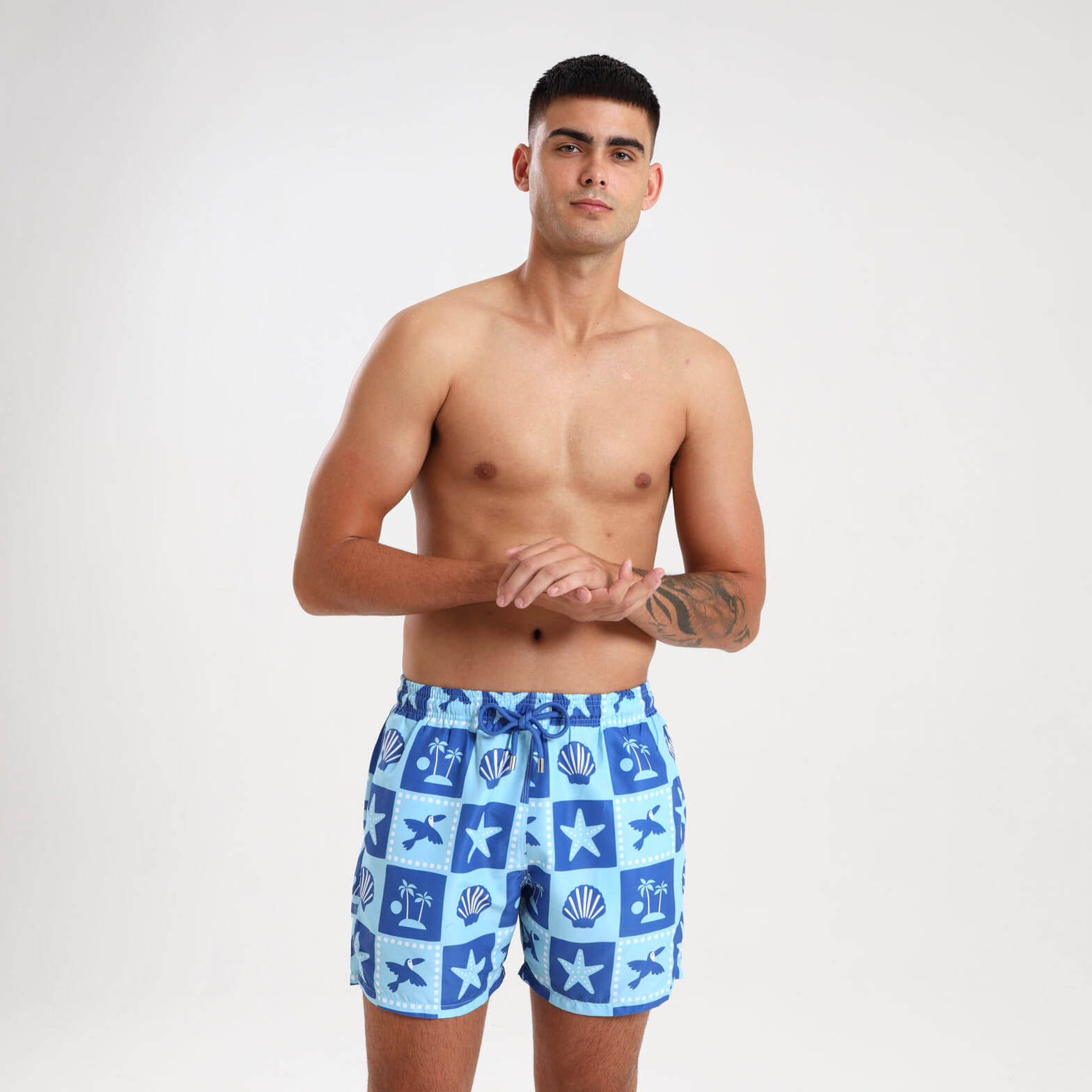 Blue swim shorts with ocean inspired mosaic pattern
