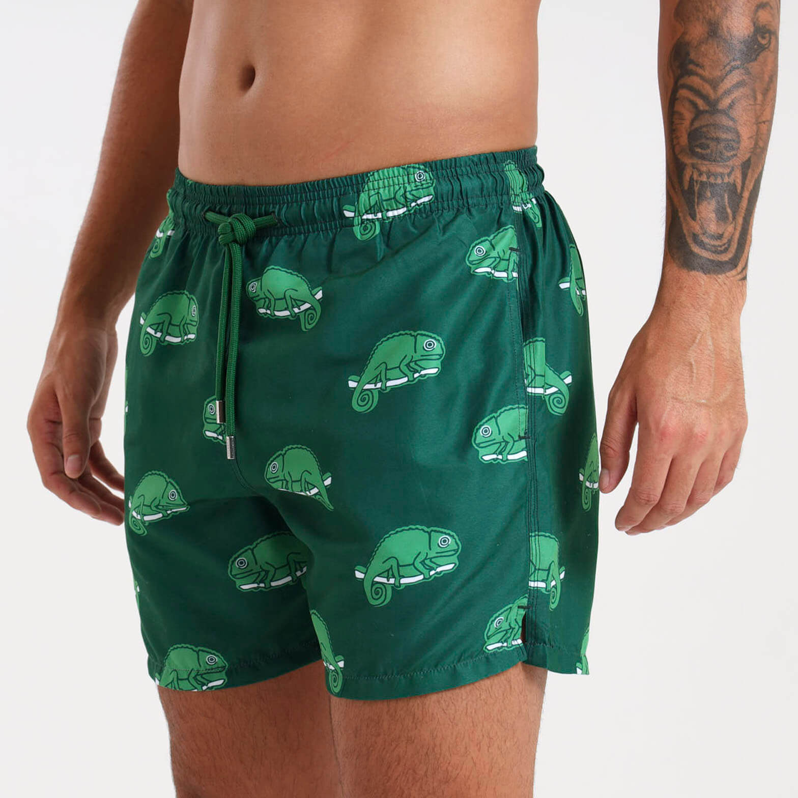 Model learning mens swim shorts with a chameleon design.