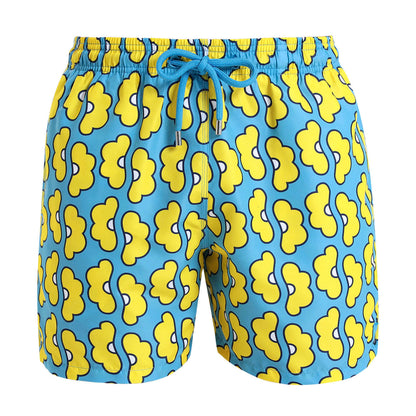 Mens swim shorts with a bright and bold yellow and blue daisy print