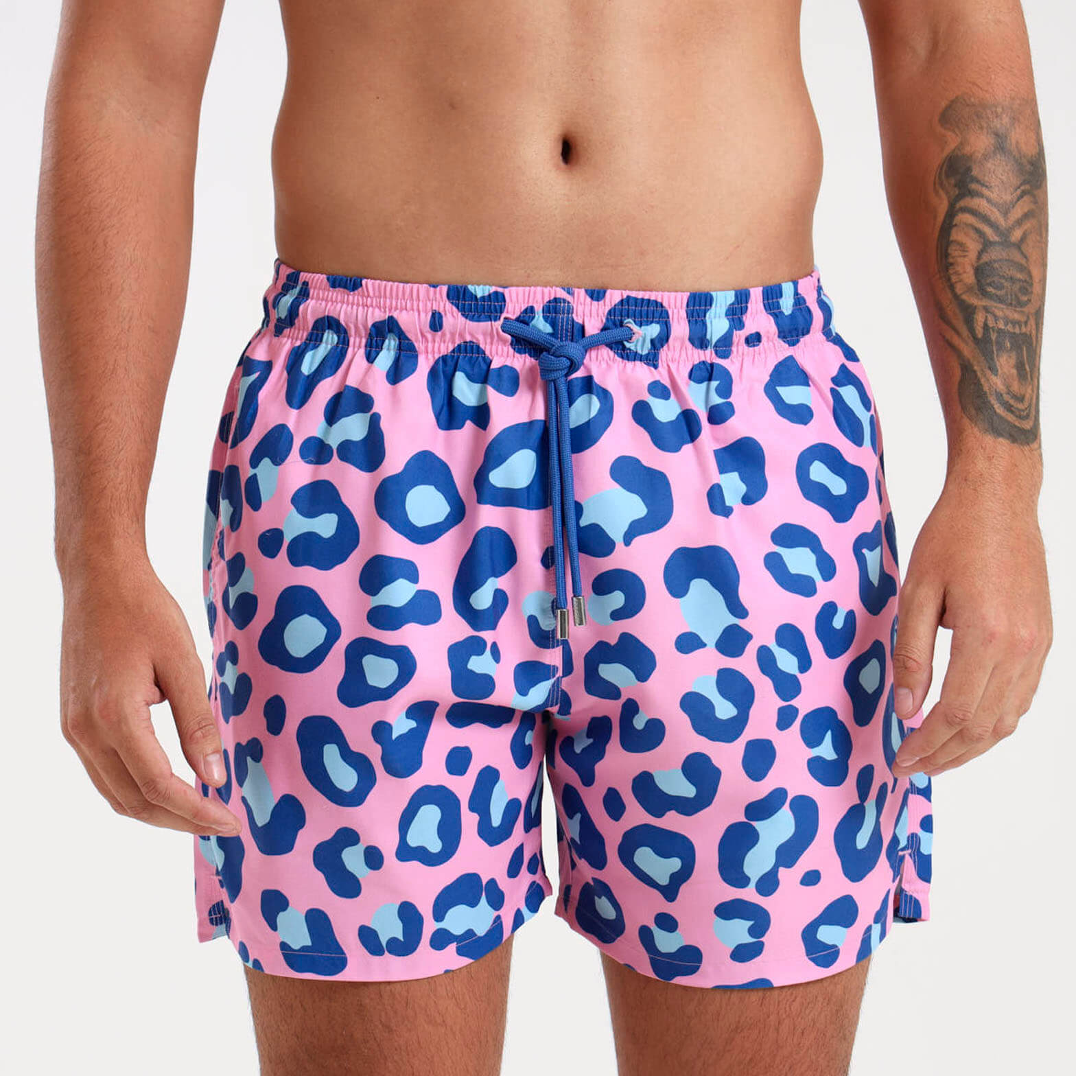 Mens swim shorts with an all over pink and blue leopard print design.