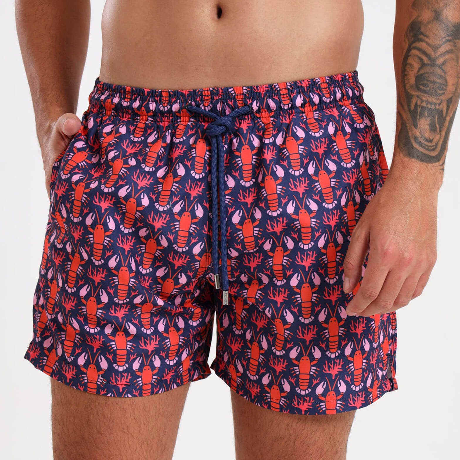 Navy swim shorts for men with a orange and pink lobster all over pattern