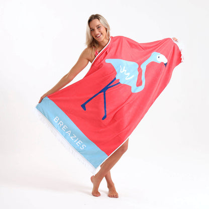 Luxury beach towel featuring a coral and blue flamingo print.