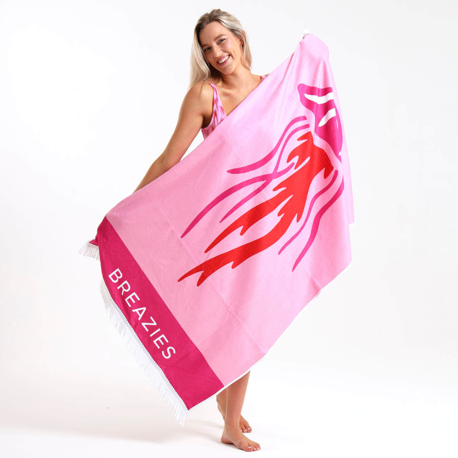 Beautiful pink beach towel featuring  a big red jellyfish design.