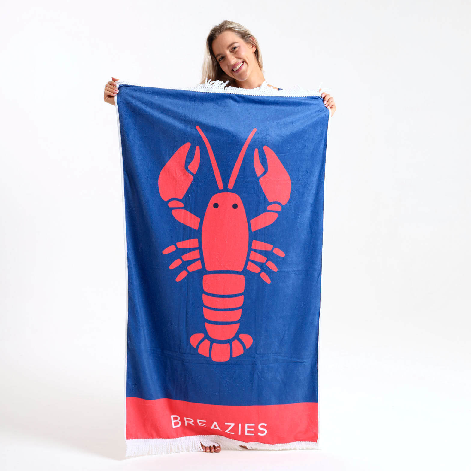 Royal blue towel with a coral lobster illustration.