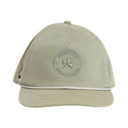 Sage cap with subtle self colour embroidery that says Breazies Beach Club