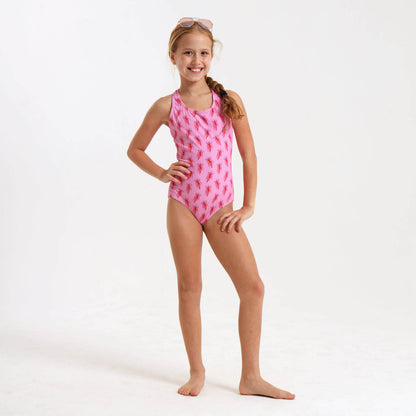 Young girl wearing a pink jellyfish inspired one piece swimming costume.