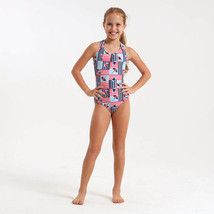 Girl wearing blue striped swimsuit with an umbrella design.