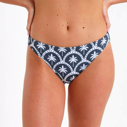 Steel blue bikini bottom with an all over white palm print.